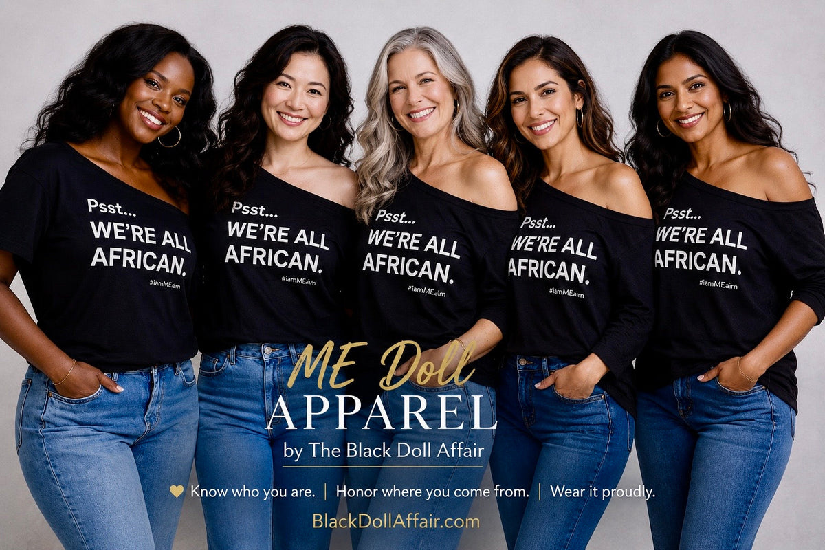 Five diverse women wearing ME Doll Apparel off-the-shoulder T-shirts reading "Psst... We're All African." by The Black Doll Affair, celebrating shared human ancestry inspired by Mitochondrial Eve. 