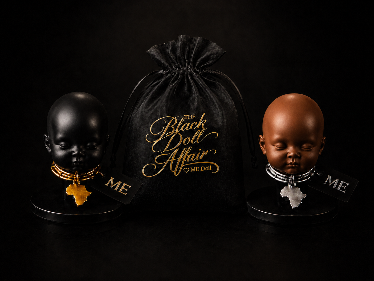Black and brown ME Doll heads with Africa pendants displayed beside a black organza Black Doll Affair organza doll head bag